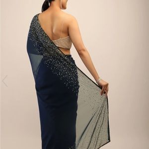 Blue saree with gold embellished border and matching satin gold blouse